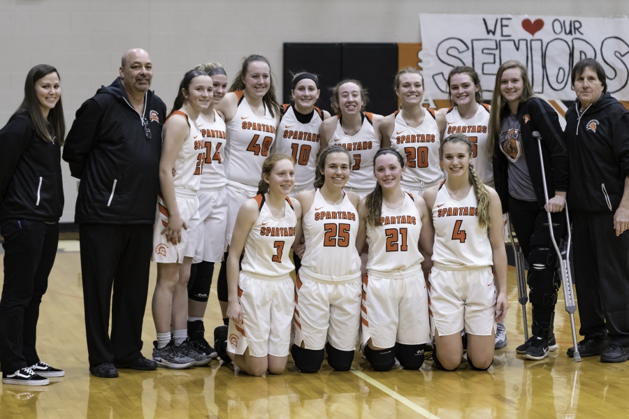 girls basketball team posing